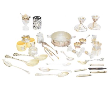 A large selection of silver and white metal items, to include a pair of silver candlesticks, a pair of crystal and silver kni