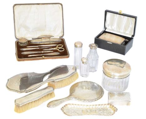 A large selection of silver, to include a cased brush and comb set, a cased manicure set, a pin tray, a three piece silver ba