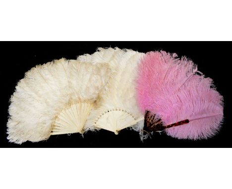 Four ostrich feather fans to include one ivory and one bone white feather fan, a faux tortoiseshell fan with pink feathers an