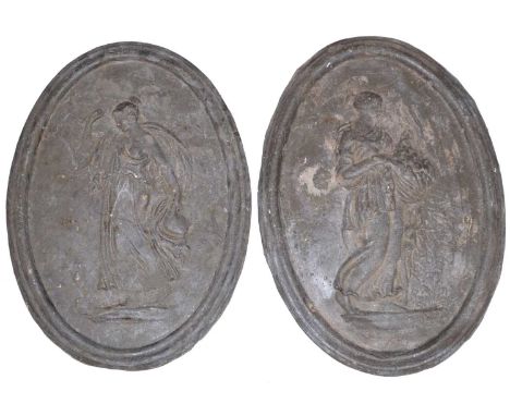 A pair of oval cast lead wall plaques, each supporting classical figures, water carrier and flower maiden.38cm (15") x 27cm (