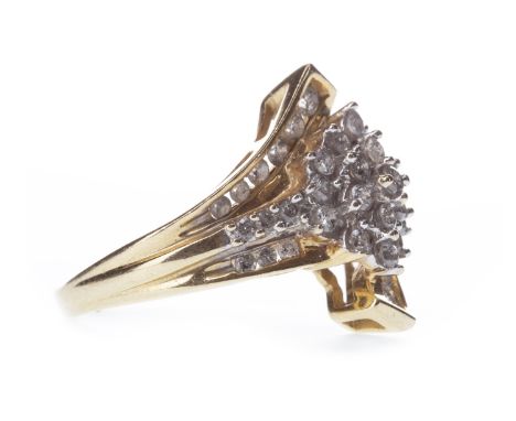DIAMOND CLUSTER RING, the asymmetrical bezel with central diamond cluster formed by round brilliant cut diamonds totalling ap