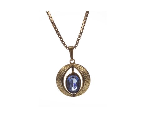GEM SET PENDANT ON CHAIN the gold plated circular pendant with oval blue gem, marked 'AMERIK, K&amp;L' to the reverse, on a n
