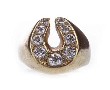 GENTLEMAN'S DIAMOND RING, in the form of a horseshoe, the old cut diamonds totalling approximately 1.10 carats, in nine carat