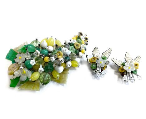 MID TWENTIETH CENTURY GLASS BEADED CLIP, in the form of a floral spray, 11cm long, along with a pair of similar clip earrings