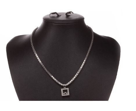 CHOPARD HAPPY DIAMONDS PENDANT, of square form, with three free moving round brilliant cut diamonds under crystal, within a d