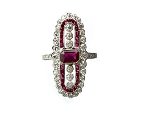 RUBY, SPINEL AND DIAMOND RING, the step cut ruby flanked by calibre cut rubies and round brilliant cut diamonds, the diamonds