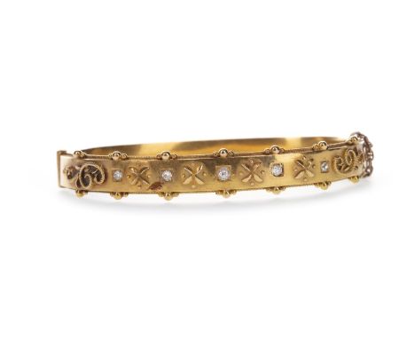 DIAMOND SET BANGLE, with five old cut diamonds totalling approximately 0.20 carats, interspaced by 'X' motifs and overlaid ro