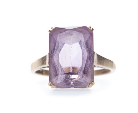 AMETHYST SINGLE STONE RING, set with a rectangular faceted amethyst 13.5mm long, in nine carat gold, with full hallmarks for 