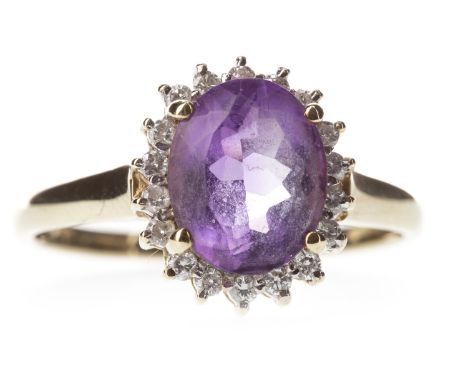 AMETHYST AND DIAMOND CLUSTER RING, the oval amethyst 10mm long, within a diamond halo, the diamonds totalling approximately 0