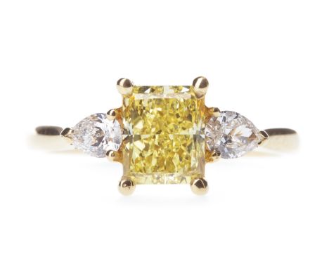 GIA CERTIFICATED FANCY VIVID YELLOW DIAMOND RING, the cut cornered rectangular modified brilliant diamond of approximately 1.