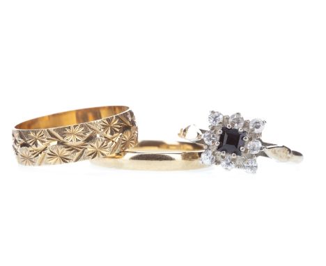TWO NINE CARAT GOLD WEDDING BANDS, each size R, 5.3g gross, along with a blue and white gem set ring, marked GOLSIL, size Q, 