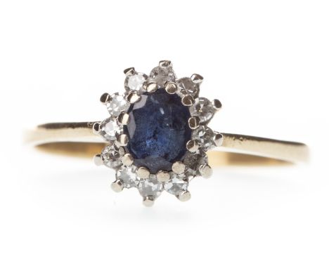 SAPPHIRE AND DIAMOND CLUSTER RING, the oval sapphire within a round brilliant cut diamond halo, the diamonds totalling approx