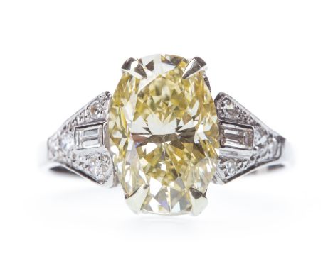 GIA CERTIFICATED FANCY LIGHT YELLOW DIAMOND RING, the oval diamond of approximately 3.02 carats with accompanying report numb
