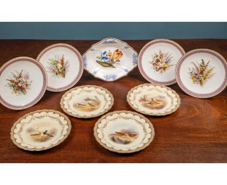 Four Royal Worcester 'vitreous' plates, printed and painted with various game and wild birds in natural settings, the borders