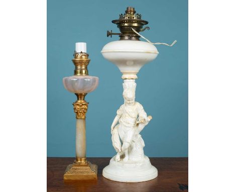 Two oil lamps, converted for electricity, the first an alabaster composite column with a gilt metal capital and base, the sec