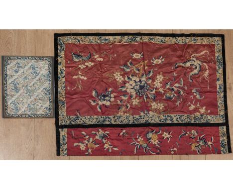 Two Chinese embroidered silks with floral decorations, one on a red ground with a black border, the other on a white ground w
