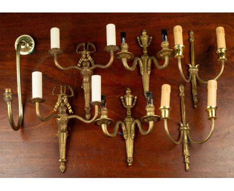 Three pairs of brass two-light wall brackets, classically styledthe tallest measuring 28cm highQty: 6Minor abrasions and scuf
