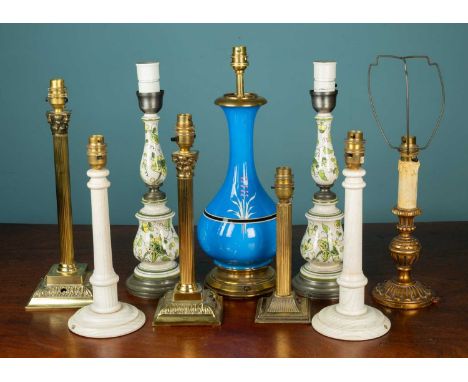 A collection of nine table lamps to include a Chinese style cobalt blue porcelain lamp with brass base; a pair of porcelain a