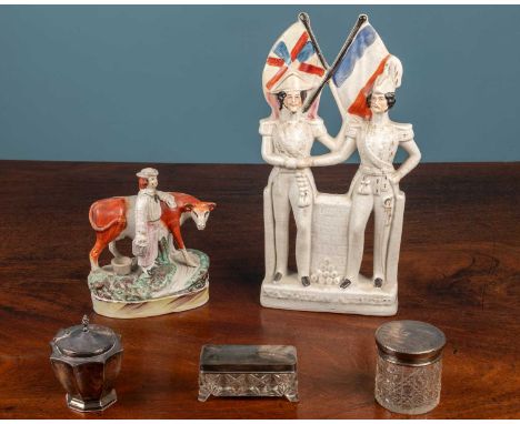 A Staffordshire Crimea figure 35cm high, another staffordshire figure and three silver topped jars.some hairline crack and ma