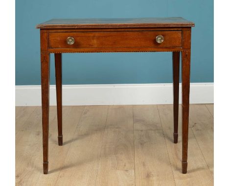 A Regency mahogany side table with a rosewood cross banded top, single frieze drawer and standing on square tapering legs ter