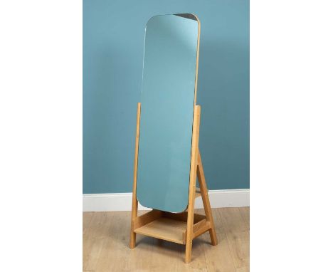 A modern cheval mirror with an oak frame, the mirror plate raised above a shelf175cm highQty: 1Some marks to the mirror plate