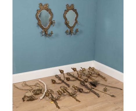 A collection of brass and metal items to include a pair of mirrors with brass frames surmounted by Apollo riding his chariot;