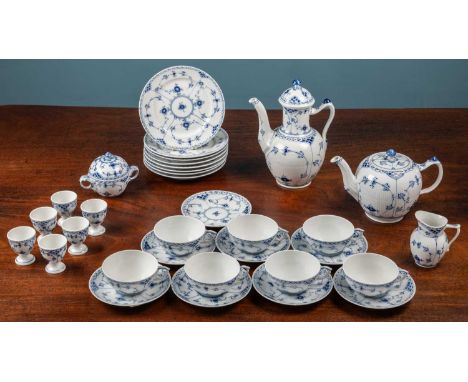 A 1960s Royal Copenhagen tea service comprising seven cups; eight saucers; eight plates; a hot water pot; a teapot; a sugar b