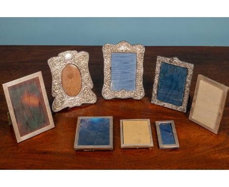 Seven silver-mounted picture frames and another white metal frame, the largest 19cm highAll with marks and minor dents
