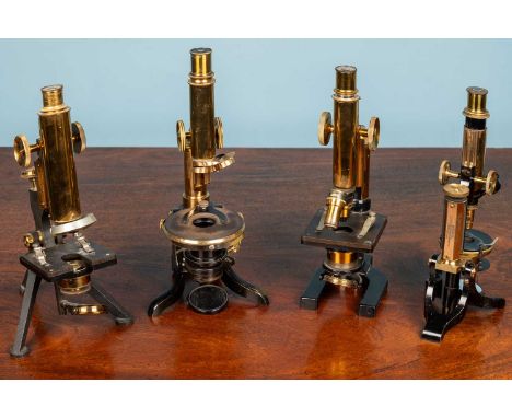 Two W Watson &amp; Sons Brass monocular microscopes to include: a Fram 8911 and a Praxis with two objective lenses of 2/3 inc