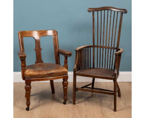 A brown leather seated hardwood desk chair with turned front legs; together with a stick back beechwood armchairthe desk chai