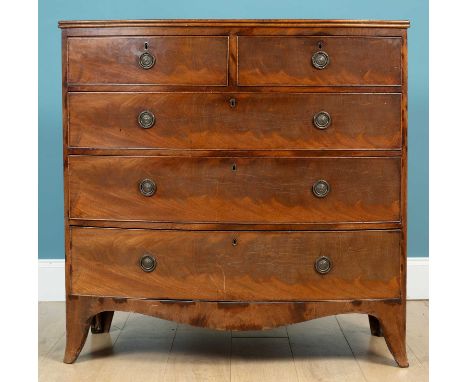 A Regency mahogany bow front chest of two short over three long drawers, with ring handles and raised on bracket feet103cm hi