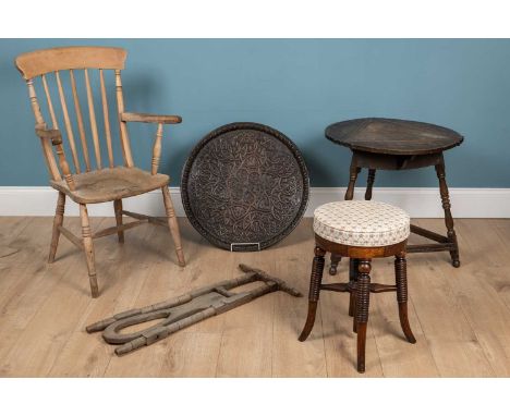 A collection of furniture to include an oak triangular drop-leaf table; a decoratively carved tray with Celtic motifs; a boot