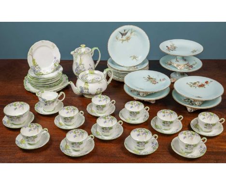 An Art Deco Parragon tea service with floral decoration, comprising a teapot, a hot water pot, ten cups, twelve saucers, twel