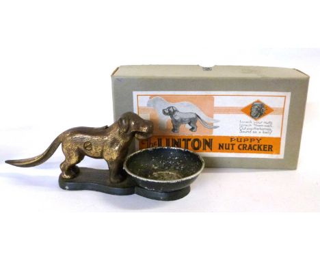 A late 1920's "The Linton Puppy Nut Cracker" cast iron dog nutcracker, patent number 273480 for 23rd June 1926, mounted on an