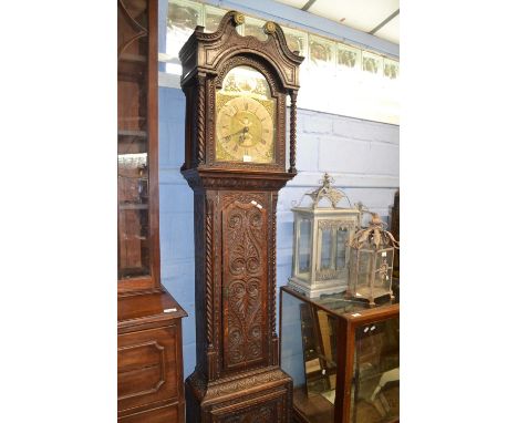 Benjamin Simpson, a Georgian brass faced long cased clock with thirty hour movement set in a later carved oak case