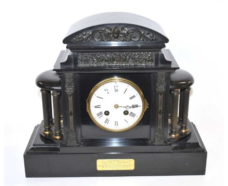 A Victorian slate clock with white enamel dial with Roman numerals
