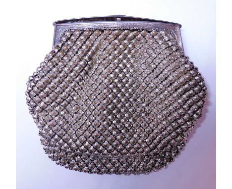 A lady's metal evening purse, with hinged fastener with engraved detailing to edges and ridged press button release, (unmarke