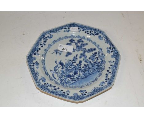 An 18th Century Chinese porcelain octagonal plate with brown line rim, blue and white chinoiserie decoration, 22cm diameter