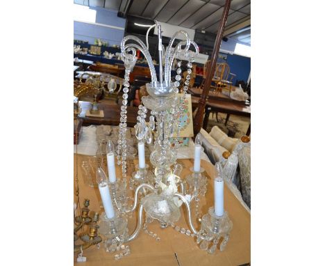 A 20th Century crystal glass chandelier with five scrolled branches, 60cm wide, 85cm high