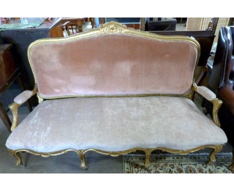 19th Century gilt wood framed sofa with arched back, open arms and serpentine front, upholstered in pink velour fabric, 170cm