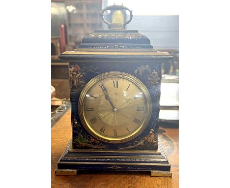 A small early 20th Century chinoiserie decorated mantel clock fitted with a brass French movement, 123cm high