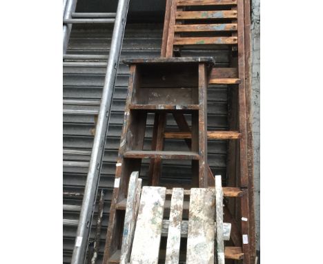 A SET OF WOODEN STEP LADDERS