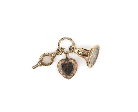 A collection of three gold pendants, mid 19th century, comprising: a chalcedony fob seal engraved with a coat of arms; an aga