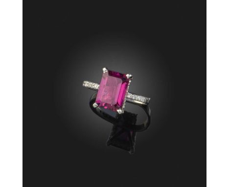 A pink tourmaline and diamond ring, the step-cut tourmaline on a fine band set with small diamonds in white gold, size N