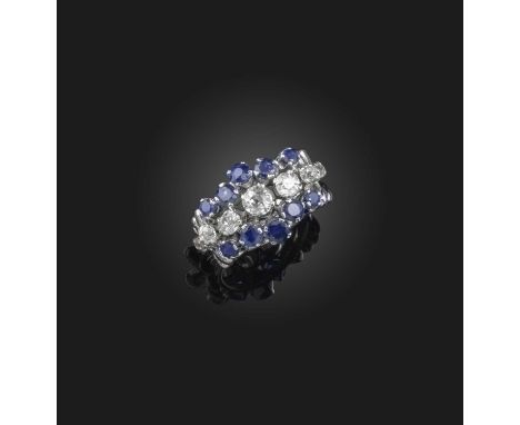 A sapphire and diamond three row ring, set with graduated round brilliant-cut diamonds within sapphire borders in white gold,