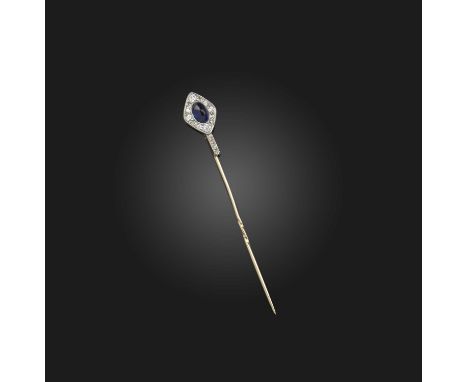 A sapphire and diamond stick pin, early 20th century composite, the top set with a cabochon sapphire within a lozenge-shaped 