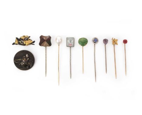 A collection of stick pins and two shakudō brooches, late 19th/early 20th century, comprising: a group of eight stick pins ca