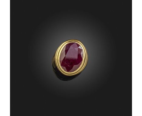 A ruby solitaire ring, collet-set with a large oval ruby measuring approximately 20.1 x 15.3 x 5.7mm, in a gold setting of fl