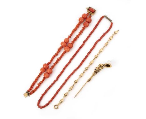 λ A collection of jewels, comprising: a late 19th century gold and enamel stick pin depicting a hand holding a top hat, lengt