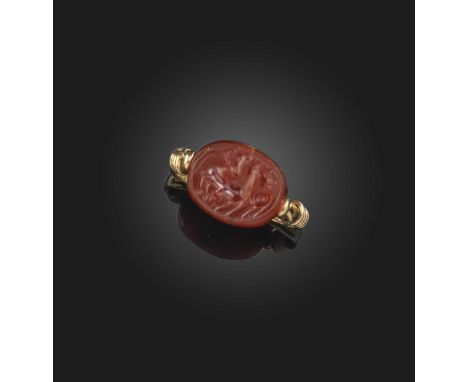 A carnelian intaglio ring, set with a rotating carnelian scaraboid bead, the reverse depicting a man riding a horse, another 